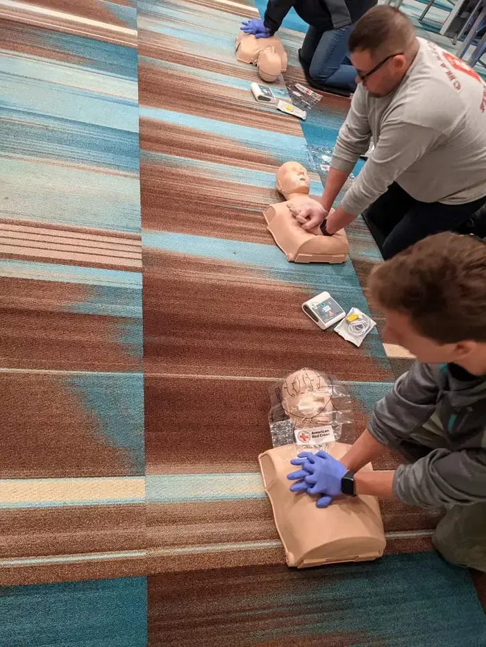 People giving chest compressions 2